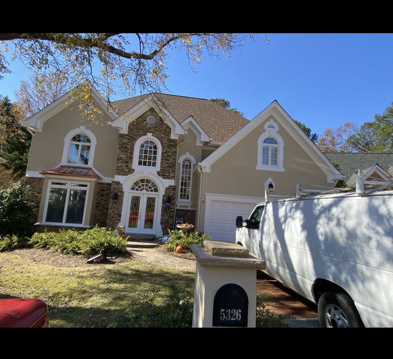 Freshly painted stucco and stone home